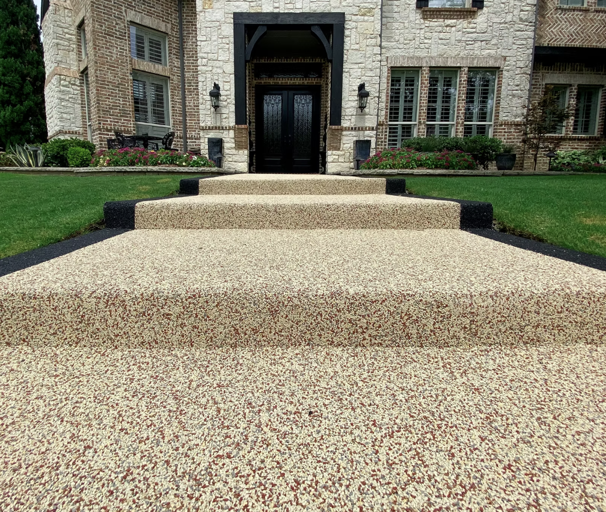 Rubber surfacing installed across patio and walkway — finished surface